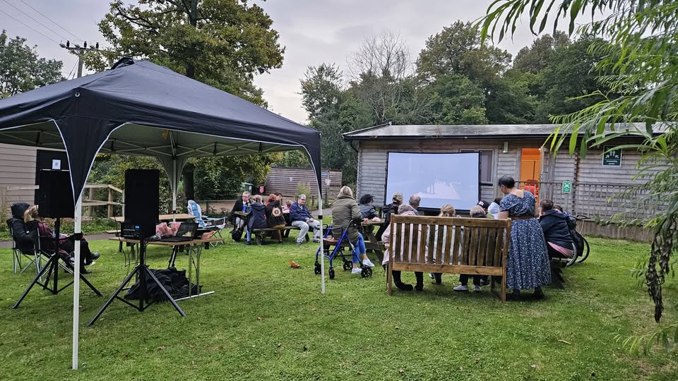 People enjoying an outdoor film show